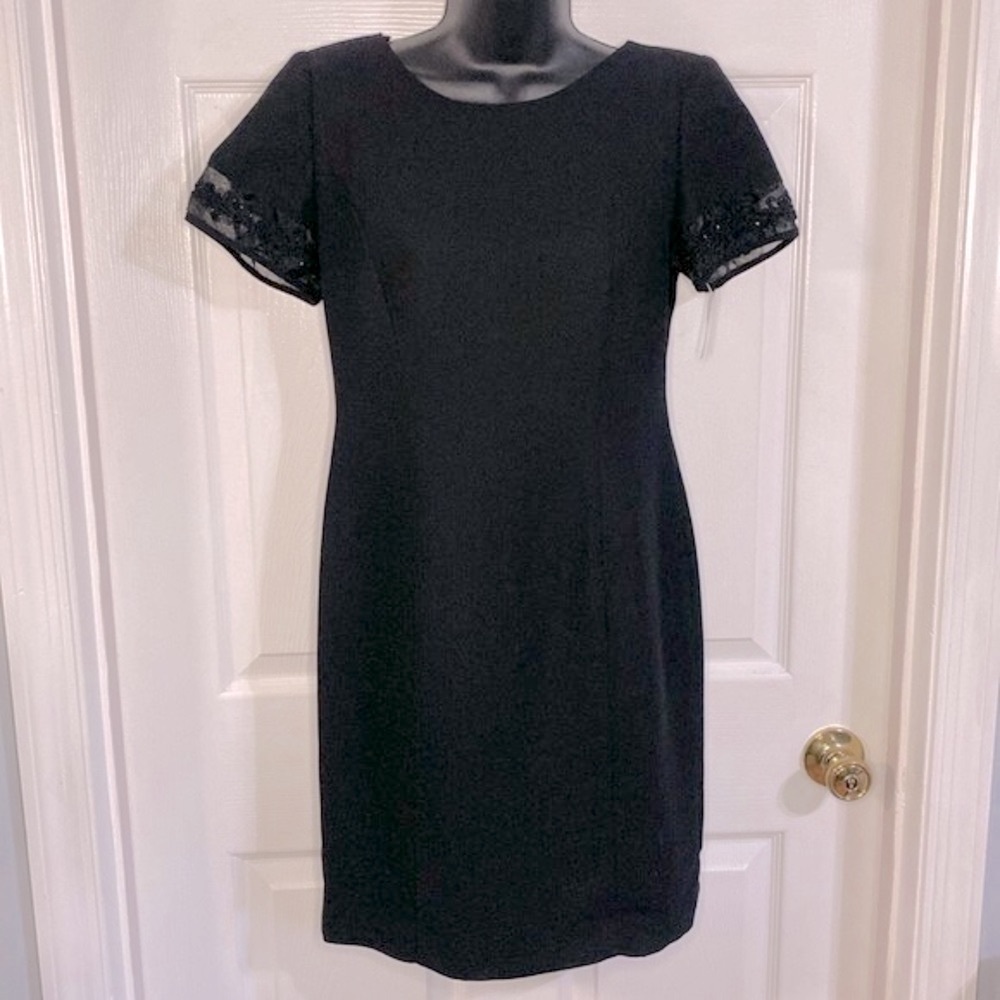 Plaza South black dress with beaded trim on sleeves, size 6P. NWT.